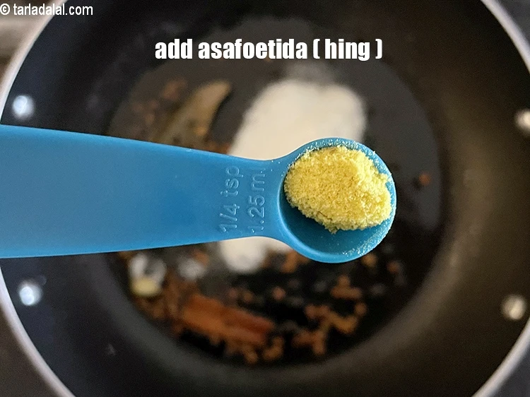 Step 13 – <html><head></head><body><p>Add&nbsp;a pinch of&nbsp;<a href="glossary-asafoetida-hing-113i">asafoetida (hing)</a>.</p></body></html>