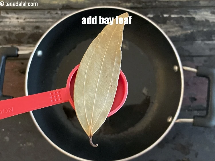 Step 4 – <html><head></head><body><p>Add&nbsp;1&nbsp;<a href="glossary-bay-leaf-tejpatta-bay-leaves-189i">bay leaf (tejpatta)</a>.</p></body></html>