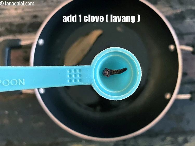 Step 6 – <html><head></head><body><p>Add&nbsp;1&nbsp;<a href="glossary-cloves-laung-lavang-322i">clove (laung / lavang)</a>.</p></body></html>