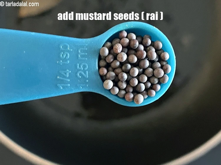 Step 9 – <html><head></head><body><p>Add&nbsp;1/4 tsp&nbsp;<a href="glossary-mustard-seeds-sarson-rai-sarson-ke-beej-525i">mustard seeds ( rai / sarson)</a>.</p></body></html>