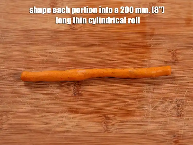 Step 14 – <p>Roll each portion into a 200 mm. (8") long thin cylindrical roll.</p>