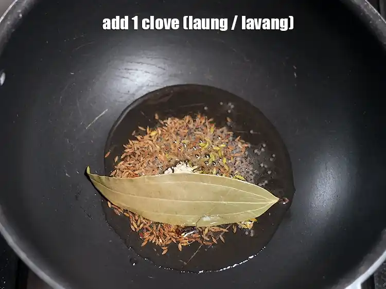 Step 32 – <html><head></head><body><p>Add&nbsp;1&nbsp;<a href="glossary-cloves-laung-lavang-322i">clove (laung / lavang)</a>.</p></body></html>