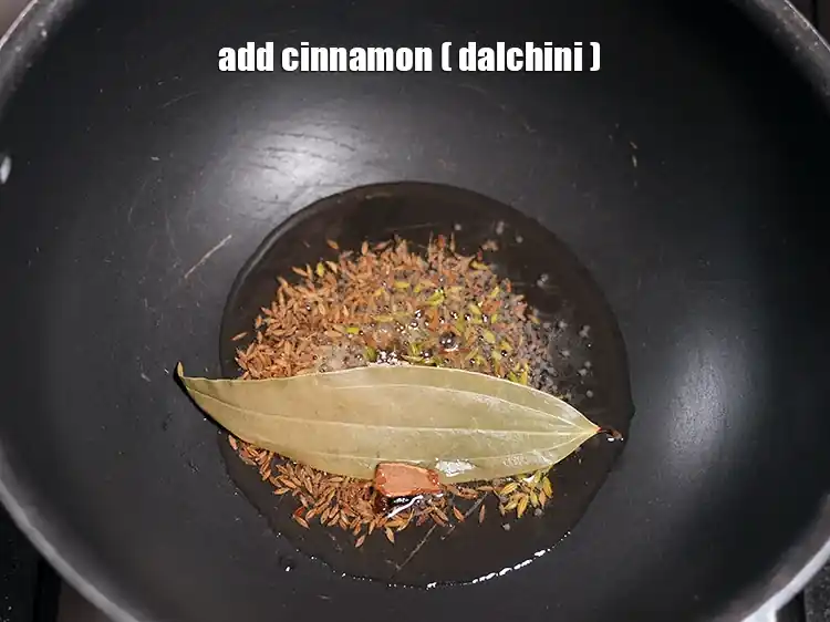 Step 33 – <html><head></head><body><p>Add&nbsp;25 mm&nbsp;(1") piece of&nbsp;<a href="glossary-cinnamon-dalchini-346i">cinnamon (dalchini)</a>.</p></body></html>