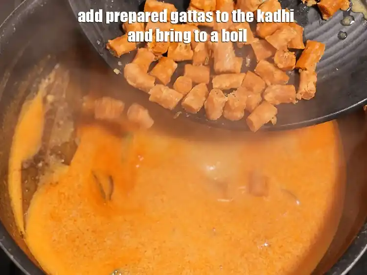 Step 45 – <p><span style="background-color:rgb(255,255,255);color:rgb(0,0,0);">Add the prepared gattas to the kadhi and bring to a boil.</span></p>