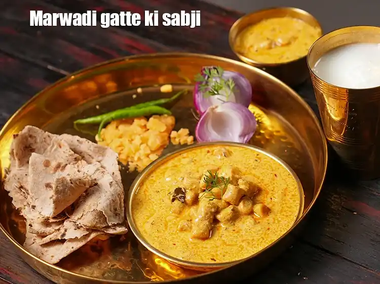 Step 47 – <p><span style="background-color:rgb(255,255,255);color:rgb(0,0,0);">Serve the </span><strong>gatte ki kadhi</strong><span style="background-color:rgb(255,255,255);color:rgb(0,0,0);"> hot.</span></p>