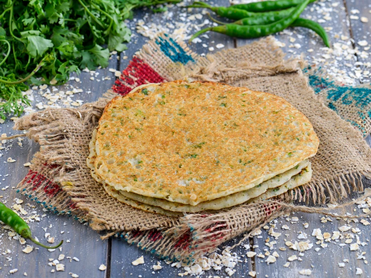 Step 24 – <p>Serve the <strong>instant oats dosa</strong> immediately with <a href="https://www.tarladalal.com/green-chutney-how-to-make-green-chutney-recipe-22266r">green chutney</a>.</p>
