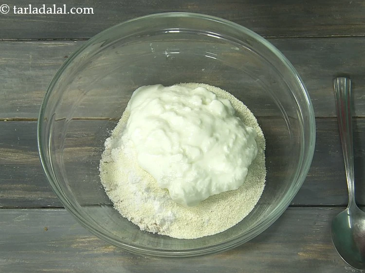 Step 9 – <p>Add dahi. It will provide a pleasant sourness to the dosa batter.</p>