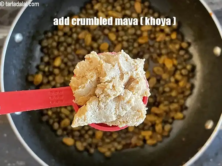 Step 23 – <html><head><meta charset="UTF-8"> </head><body><p>Add&nbsp;2 tbsp&nbsp;<a href="glossary-crumbled-mawa-2259i">crumbled mava (khoya)</a>.</p></body></html>