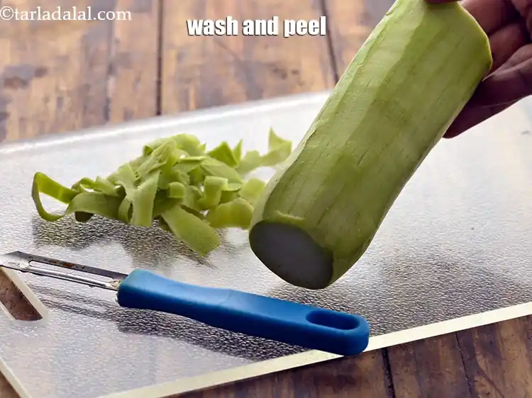 Step 4 – <p>To make&nbsp;<strong>flax seed raita, </strong>Wash and peel the bottle gourd.</p>