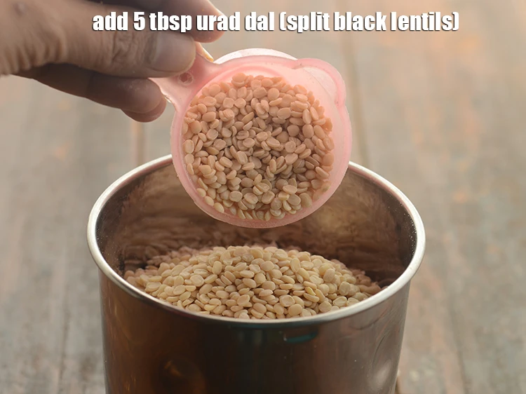 Step 14 – <p>Add the 5 tbsp <a href="https://www.tarladalal.com/glossary-urad-dal-split-black-lentil-941i"><u>urad dal (split black lentils)</u></a><u>.</u></p>