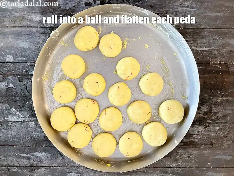 Step 22 – <p>Our kesar peda is very soft right now. So its best to cling wrap them …