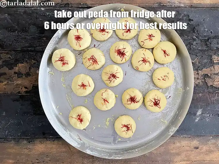 Step 23 – <p>Take out of the fridge in 6 hours. The kesar peda is fairly firm and …