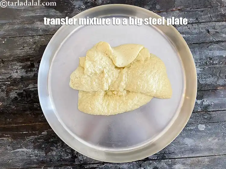 Step 9 – <html><head><meta charset="UTF-8"></head><body><p>Transfer the mava mixture into a large plate.&nbsp;</p></body></html>