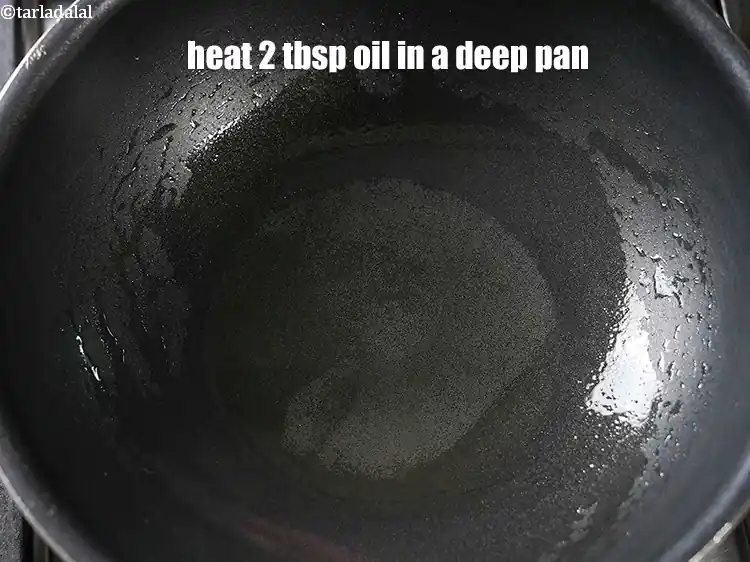 Step 15 – <p>To make <strong>egg curry recipe</strong>, heat 2 tbsp oil in a deep pan.</p>