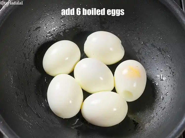 Step 16 – <p>Add 6 <a href="https://www.tarladalal.com/glossary-boiled-eggs-2369i">boiled eggs</a>.</p>