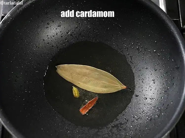 Step 22 – <p>Add 1&nbsp;<a href="https://www.tarladalal.com/glossary-cardamom-elaichi-262i">cardamom (elaichi)</a>.</p>