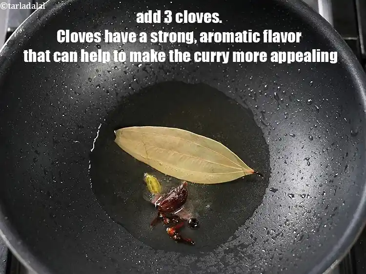Step 25 – <p>Add 3 <a href="https://www.tarladalal.com/glossary-cloves-laung-lavang-322i">cloves (laung / lavang)</a>. Cloves have a strong, aromatic flavor that can …