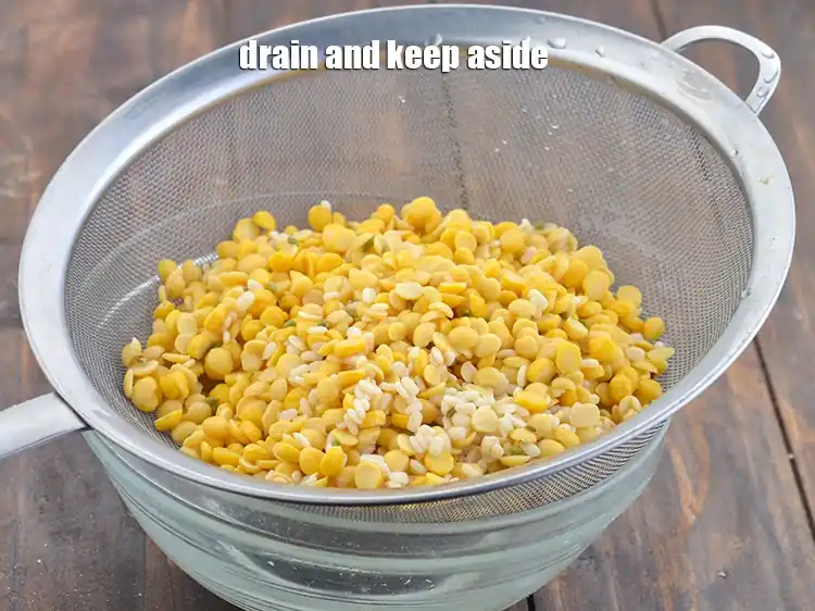 Step 3 – <p><span style="background-color:rgb(255,255,255);color:rgb(0,0,0);">Drain and keep aside. Remove ¼ cup of soaked and drained chana dal mixture …