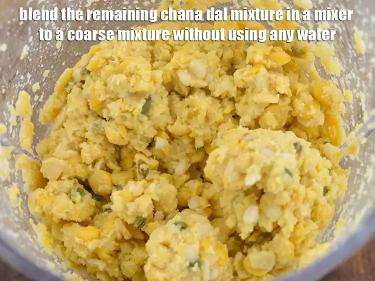 Step 4 – <p><strong>Blend</strong> the remaining chana dal mixture in a mixer to a coarse mixture <strong>without using …