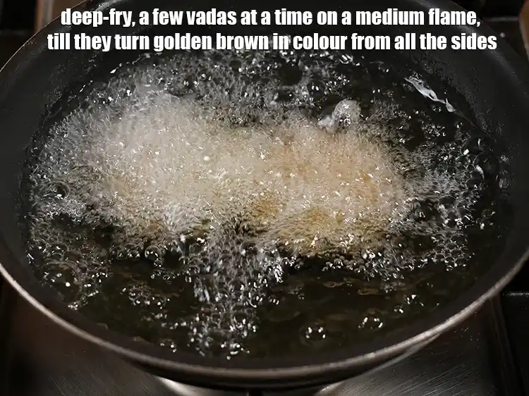 Step 8 – <p>Heat the <a href="https://www.tarladalal.com/glossary-oil-671i"><u>oil&nbsp;</u></a> in a deep non-stick kadhai and deep-fry, a few <strong>vadas</strong> at …