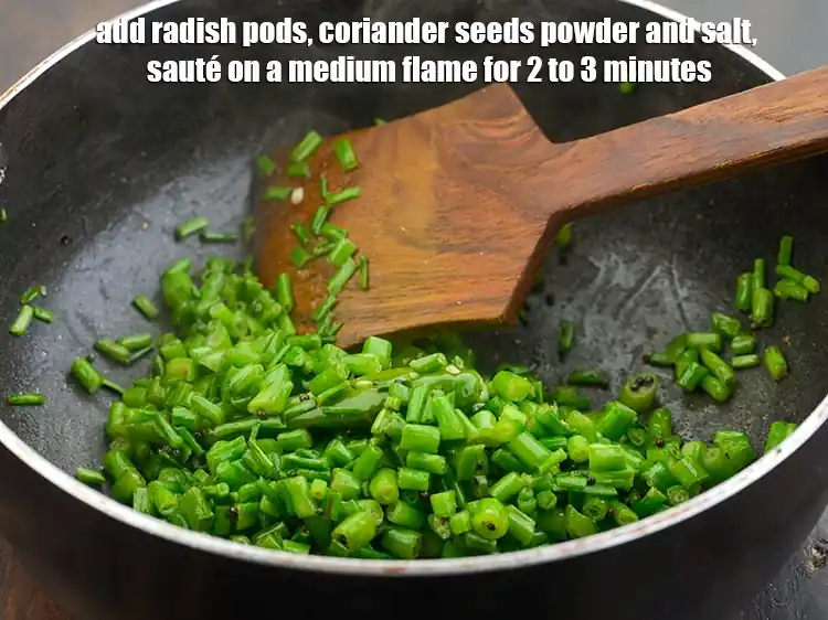 Step 5 – <p><span style="background-color:rgb(255,255,255);color:rgb(0,0,0);">When the seeds crackle, add the </span>1 cup stringed and <a href="https://www.tarladalal.com/glossary-green-radish-pods-green-mogri-1813i#ing_2508"><u>chopped green radish …