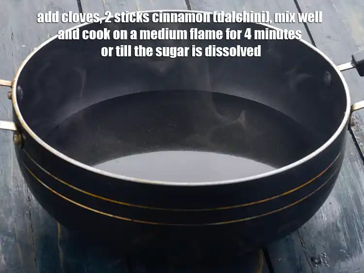 Step 3 – <p>Add 2 <a href="https://www.tarladalal.com/glossary-cloves-laung-lavang-322i"><u>clove (laung / lavang)</u></a><span style="background-color:rgb(255,255,255);color:rgb(0,0,0);">, </span>2 sticks <a href="https://www.tarladalal.com/glossary-cinnamon-dalchini-346i"><u>cinnamon (dalchini)</u></a><span style="background-color:rgb(255,255,255);color:rgb(0,0,0);"> mix …