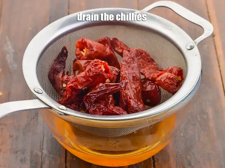 Step 3 – <p>Drain the chillies with the help of a strainer.</p>
