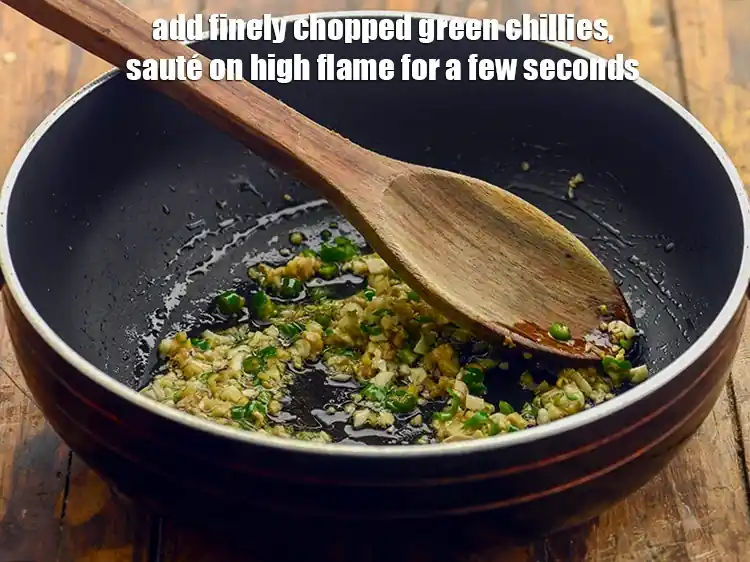 Step 19 – <p>Add 1 tsp finely <a href="https://www.tarladalal.com/glossary-green-chillies-hari-mirch-331i#ing_2388"><u>chopped green chillies</u></a> and sauté on high flame for a …