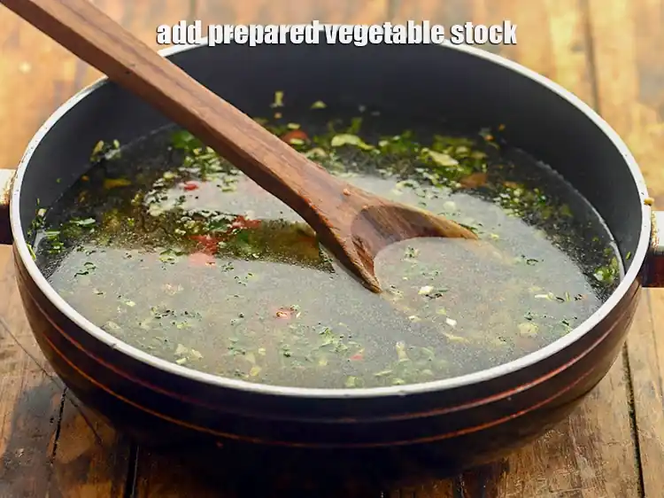 Step 28 – <p>Add the <strong>prepared vegetable stock</strong>.</p>