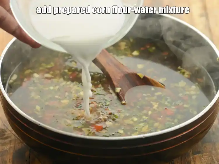 Step 33 – <p>Stir and add the <strong>prepared corn flour-water mixture</strong>. The soup must be bubbling hot when …