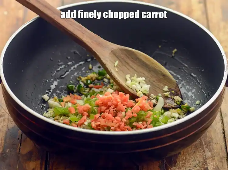 Step 12 – <p>Add 1/4 cup finely <a href="https://www.tarladalal.com/glossary-carrot-gajar-gajjar-253i#ing_2376"><u>chopped carrot</u></a>. Sauté on high flame for 1 to 2 …