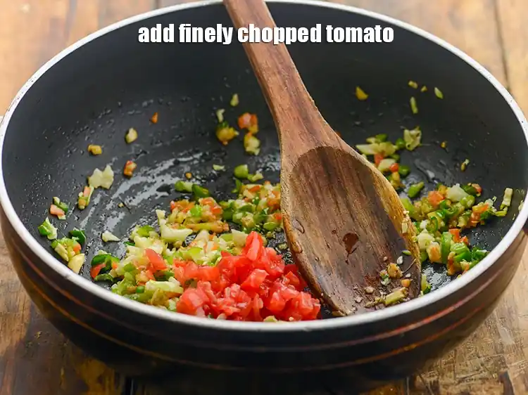 Step 13 – <p>Add the 2 tbsp finely <a href="https://www.tarladalal.com/glossary-tomatoes-tamatar-639i#ing_2361"><u>chopped tomato</u></a>. To make the soup more nutritious, you …