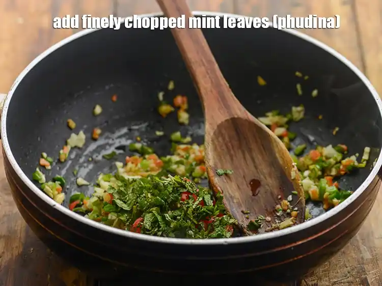 Step 14 – <p>Add 1 tbsp finely <a href="https://www.tarladalal.com/glossary-mint-leaves-pudina-phudina-521i#ing_2368"><u>chopped mint leaves (phudina)</u></a>. While pudina gives a refreshing taste …