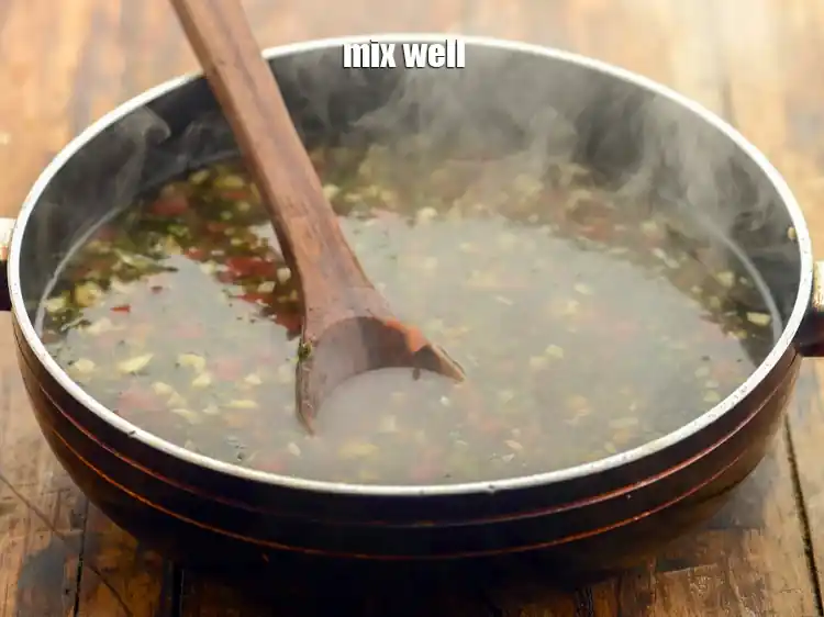 Step 25 – <p>Mix well and our&nbsp;<strong>Indo-Chinese manchow soup </strong>is ready.</p>