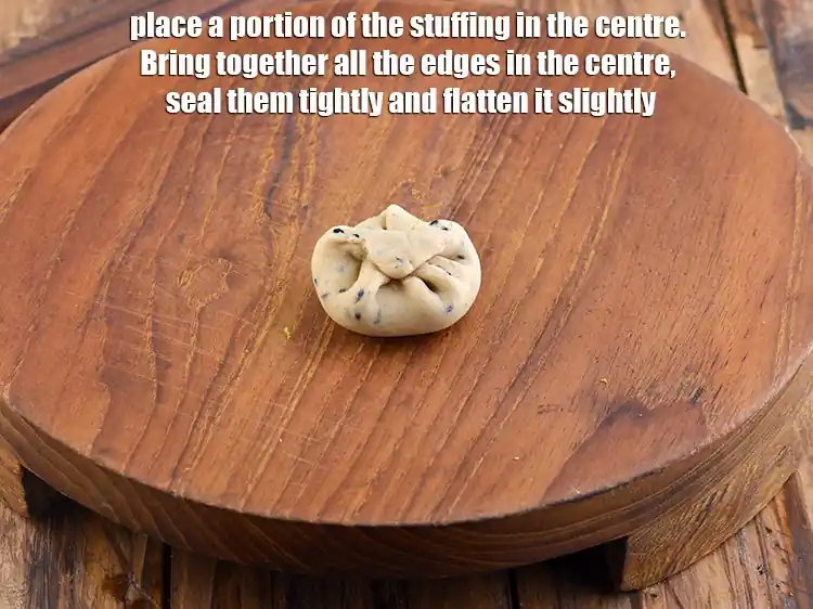 Step 9 – <p>Place a portion of the stuffing in the centre. Bring together all the edges in …