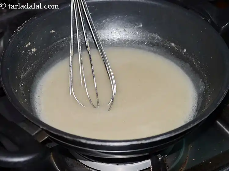 Step 7 – <p>Mix well and cook on a medium flame for 1½ minutes while stirring continuously with …