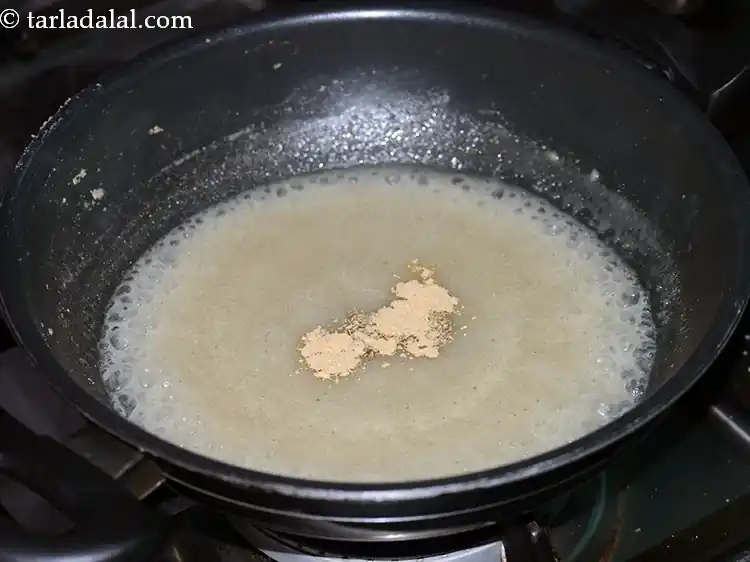 Step 9 – <p>Add the 1/8 tsp <a href="https://www.tarladalal.com/glossary-dried-ginger-1326i"><u>dried ginger (adrak) </u></a>powder.</p>