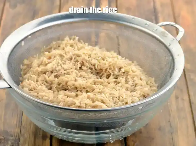 Step 3 – <p><span style="background-color:rgb(255,255,255);color:rgb(0,0,0);">Drain the </span><strong>rice</strong><span style="background-color:rgb(255,255,255);color:rgb(0,0,0);"> well with the help of a strainer.</span></p>