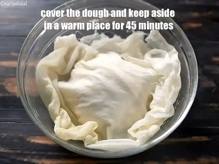 Step 13 – <p>Cover the dough with a damp muslin cloth and keep aside in a warm place …