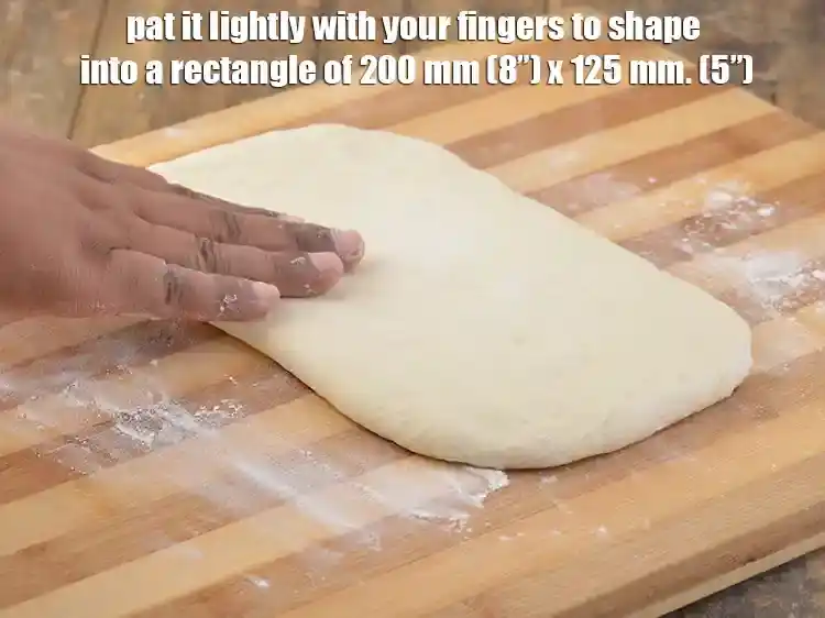 Step 15 – <p>Put the dough over it and pat it lightly with your fingers to shape into …