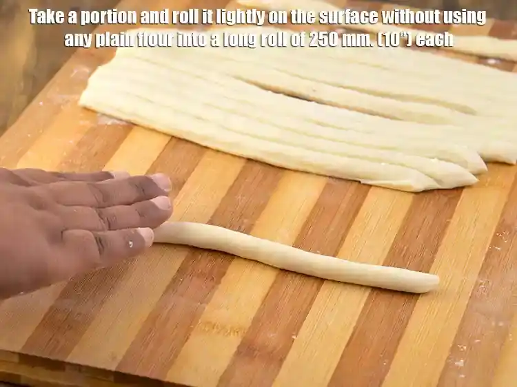 Step 17 – <p>Take a portion and roll it lightly on the surface without using any plain flour …