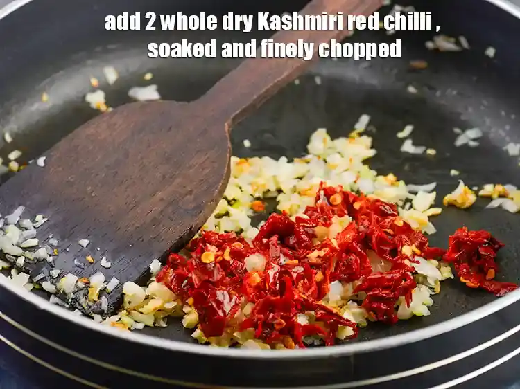Step 26 – <p><span style="background-color:rgb(255,255,255);color:rgb(0,0,0);">Add the </span>2 <a href="https://www.tarladalal.com/glossary-whole-dry-kashmiri-red-chillies-kashmiri-mirch-kashmiri-lal-mirch-332i"><u>whole dry Kashmiri red chilli </u></a>, soaked and finely chopped.</p>