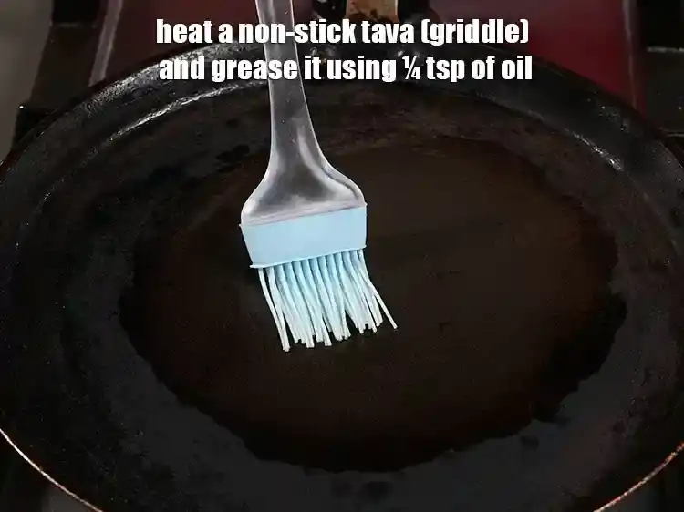 Step 34 – <p>Heat a non-stick tava (griddle) and grease it using ¼ tsp of oil.</p>