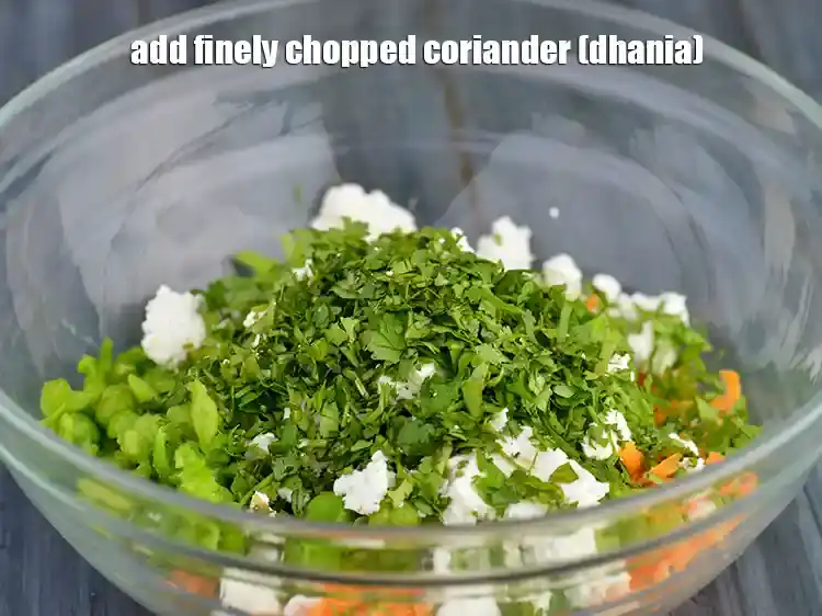 Step 11 – <p>Add vitamin A and C rich flavourful herb the fresh 2 tbsp finely <a href="https://www.tarladalal.com/glossary-coriander-dhania-kothmir-369i#ing_2365"><u>chopped …
