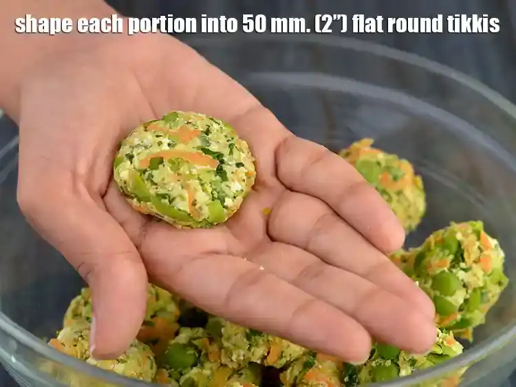 Step 18 – <p>Shape each portion into 50 mm. (2”) flat round tikki by rolling it in between …