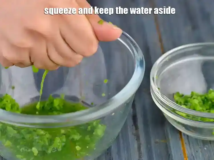 Step 6 – <p>Squeeze the grated karela with your fingers so as to remove the water aside. This …