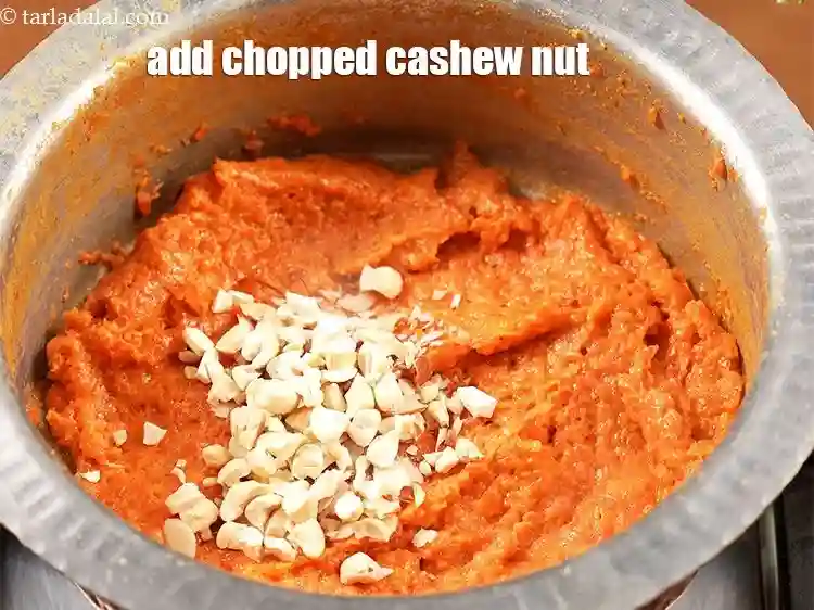 Step 14 – <p>Add 1 tbsp <a href="https://www.tarladalal.com/glossary-chopped-cashew-nut-791i">chopped cashew nut (kaju)</a>.</p>