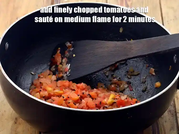 Step 3 – <p><span style="background-color:rgb(255,255,255);color:rgb(0,0,0);">Add the </span>1/2 cup <a href="https://www.tarladalal.com/glossary-tomatoes-tamatar-639i#ing_3501"><u>finely chopped tomatoes</u></a><span style="background-color:rgb(255,255,255);color:rgb(0,0,0);"> and sauté on medium flame …