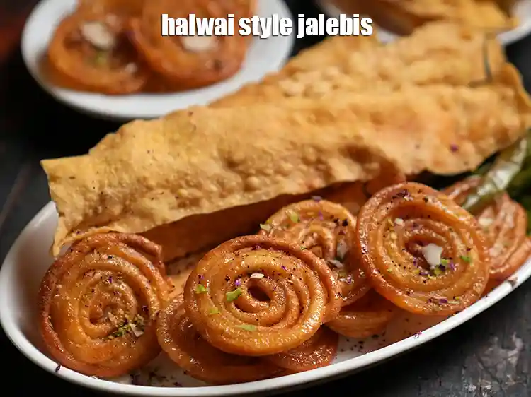 Step 28 – <p>Remove them on plate. Serve <strong>homemade crispy Jalebi </strong>immediately garnish with almond slivers, pista slivers …