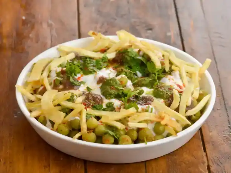 Step 2 – <p><strong>Transfer the mixture into a serving plate and spread it evenly</strong>. Put the <a href="https://www.tarladalal.com/glossary-curd-dahi-yogurt-yoghurt-383i#ing_3131"><u>whisked …